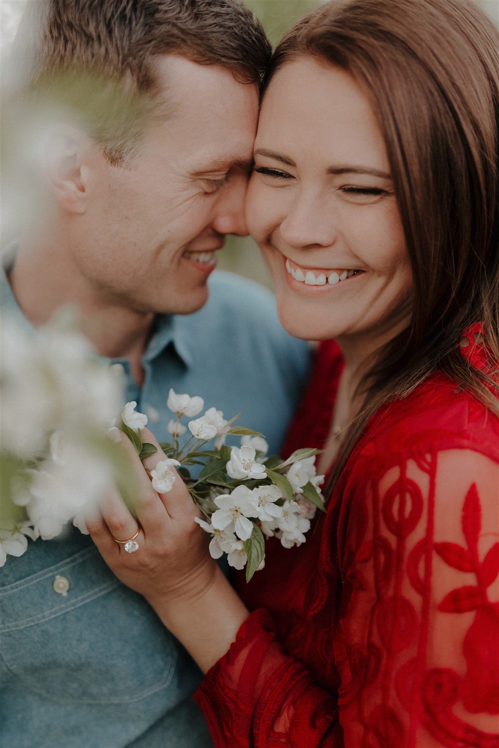 Engagement session among spring blossoms