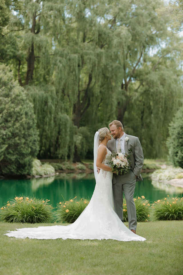 Couple embracing by the pond